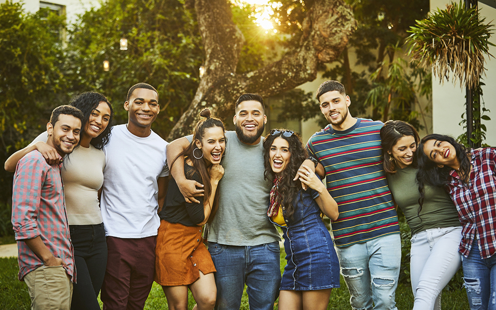 Portrait of cheerful friends. Young multi-ethnic males and females are wearing casuals