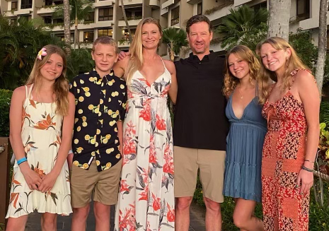 Jenny with her daughter, fiancé and what she calls her "blended" family. Jenny was able to return to her dream job as a whale and dolphin trainer in July.