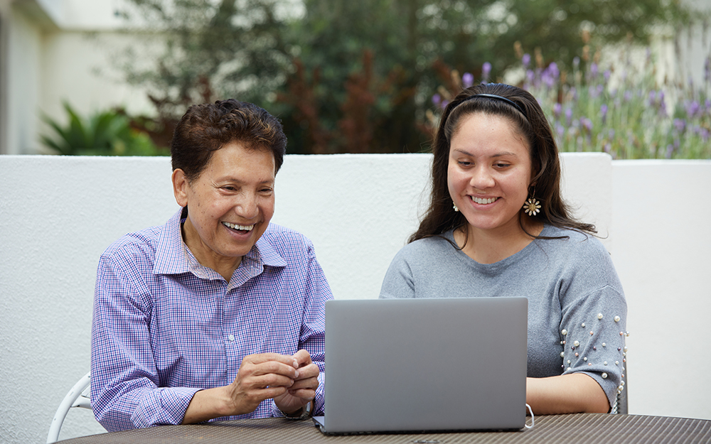 Azael with his Spanish-speaking caregiver, Maria Rodriguez. The pair have formed a strong bond, often laughing, chatting and eating together.