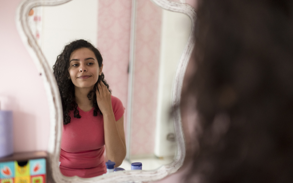 Teenage girl reflection in the mirror