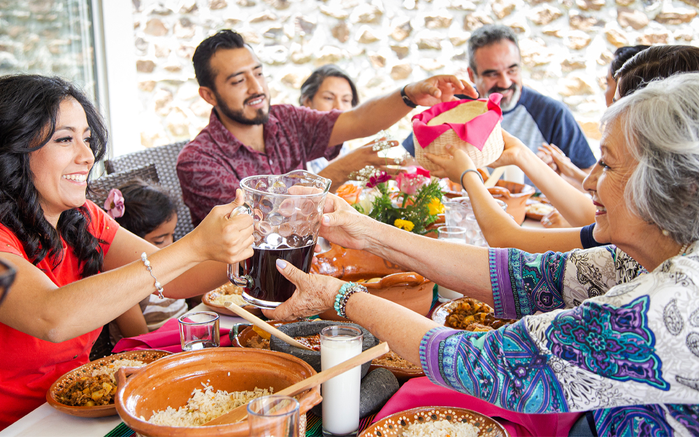 Latin American household enjoying lunch outside