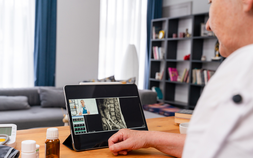 A patient getting a virtual second opinion from a spine surgeon.