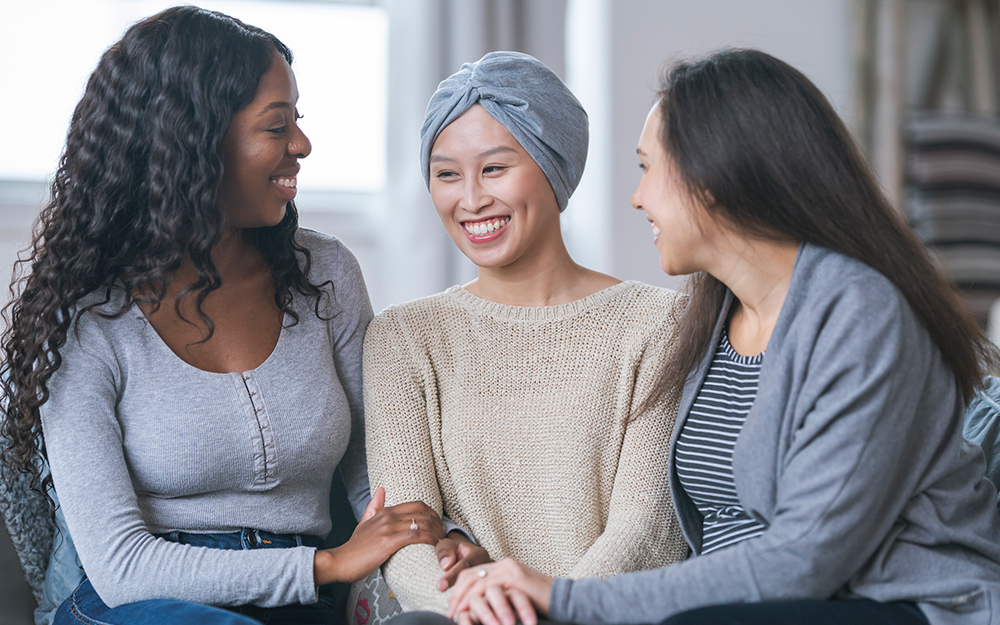 Friends supporting a woman with cancer