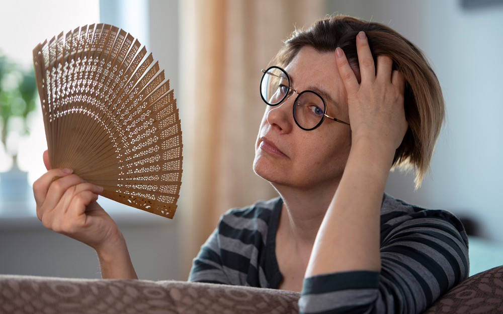 A middle age woman sweating