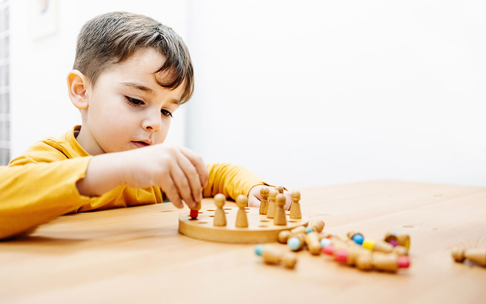 Young boy playing with a toy