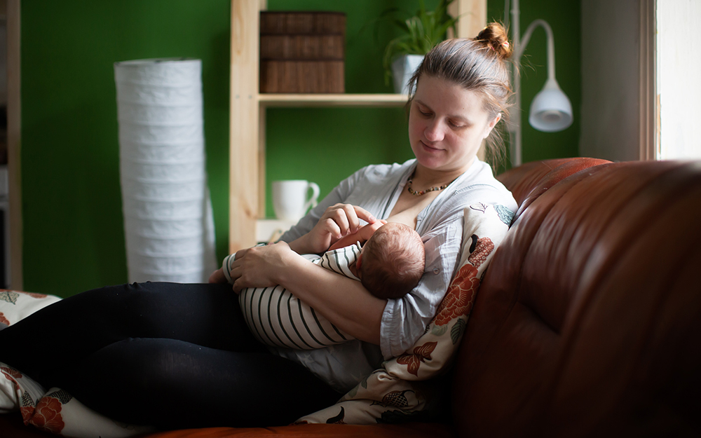 Mother breastfeeding her son