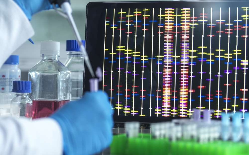 Researcher using a pipette