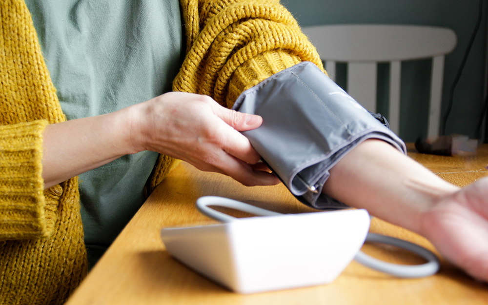 Woman taking blood pressure