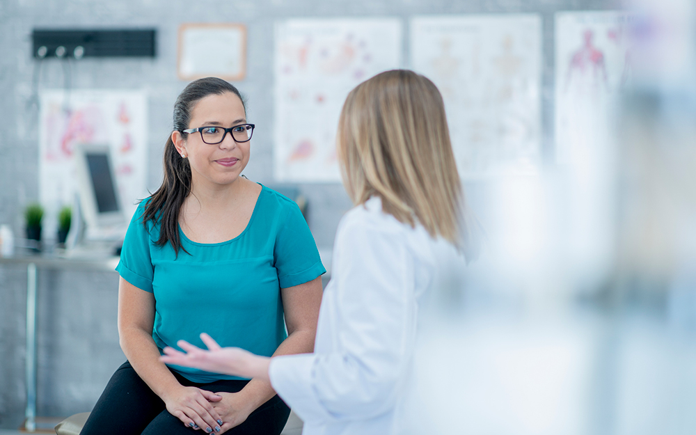 Female patient speaking with her doctor