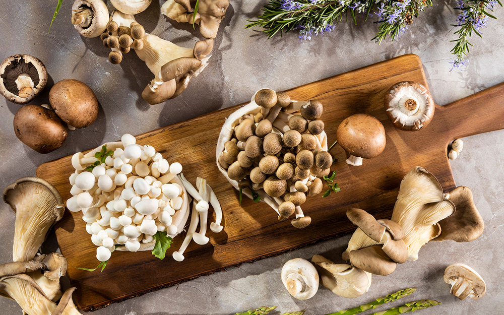 Variety of mushrooms on a cutting board