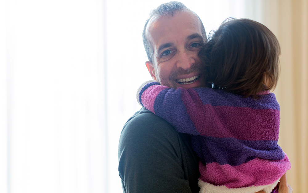 Jonathan Orner holding his daughter