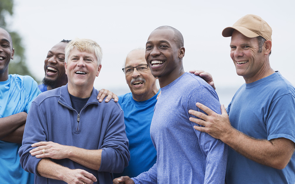 Multi-ethnic group of men standing together.