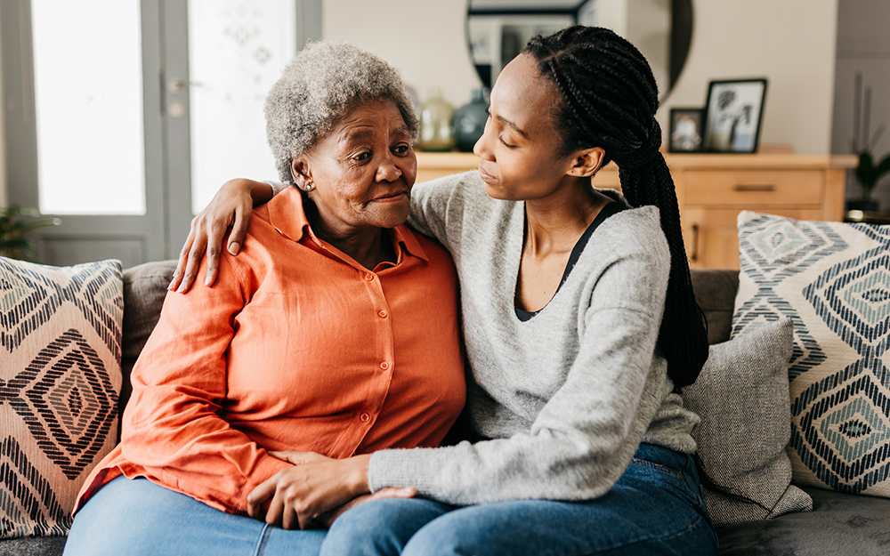 Daughter with her arm around her mother