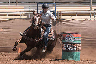 Janel Flook riding a horse.