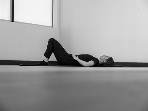Woman lying on her back.