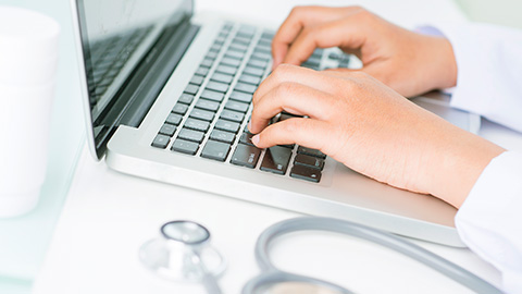 Laptop and stethoscope.