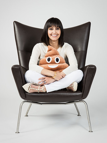 Suzanne Devkota, PhD, with a "poop pillow."