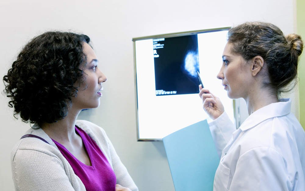 A woman speaking to her doctor about her breast scan.