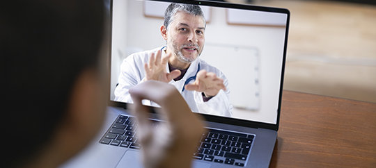 Physician having online meeting with a patient