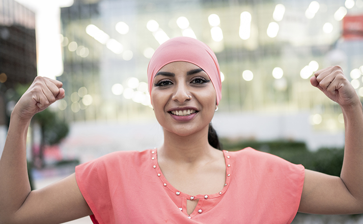 Woman cancer patient wearing a pink bandana.