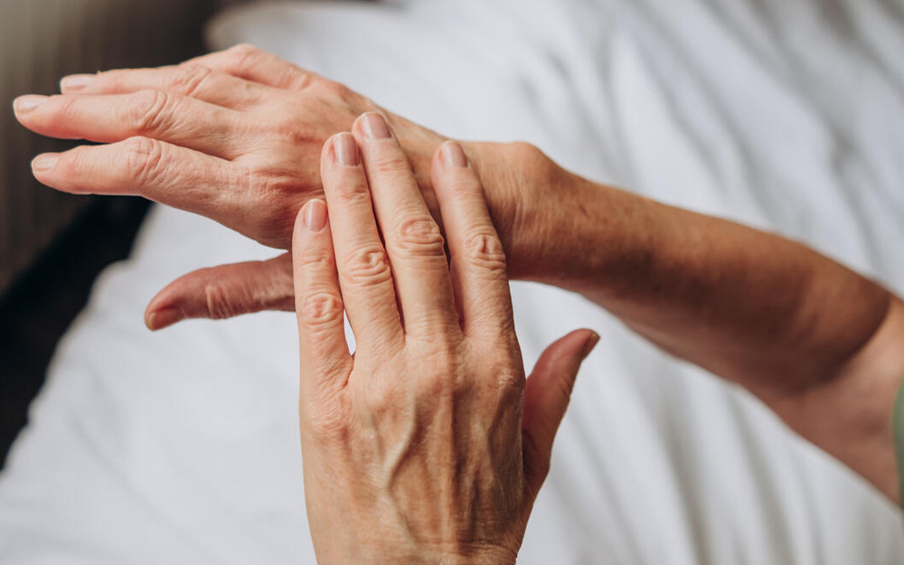 A pair of hands massaging each other