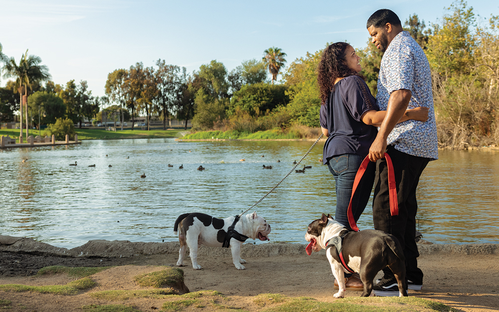 Eric Berry with his wife Cheri at the park with their dogs.