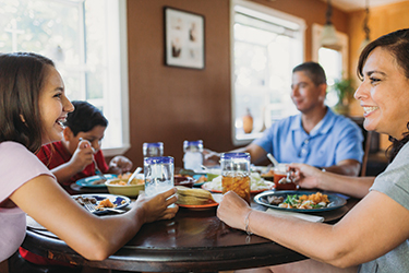 Minerva Quezada eating with her family