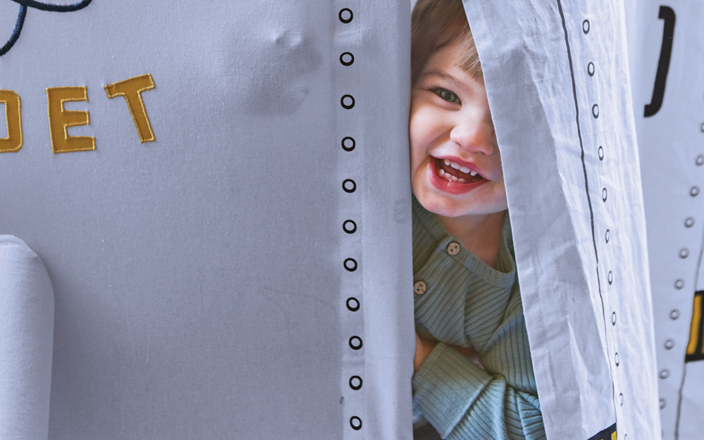 Jack Tatham plays peekaboo from his space shuttle fort at home in Playa Vista.