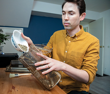 Ryan Ponec, MD, roasting coffee beans