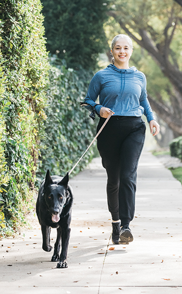 Violette Gray, MD, walking her dog