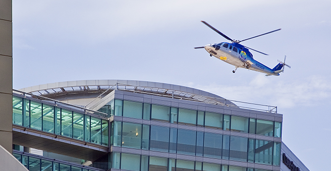 Helicopter flying over hospital.