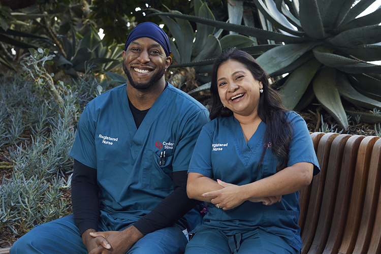 Two Cedars-Sinai nurses sitting outside