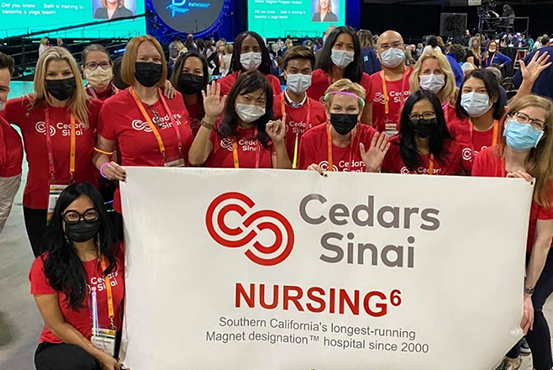 Group of Cedars-Sinai nurses holding a Cedars-Sinai Nursing banner.