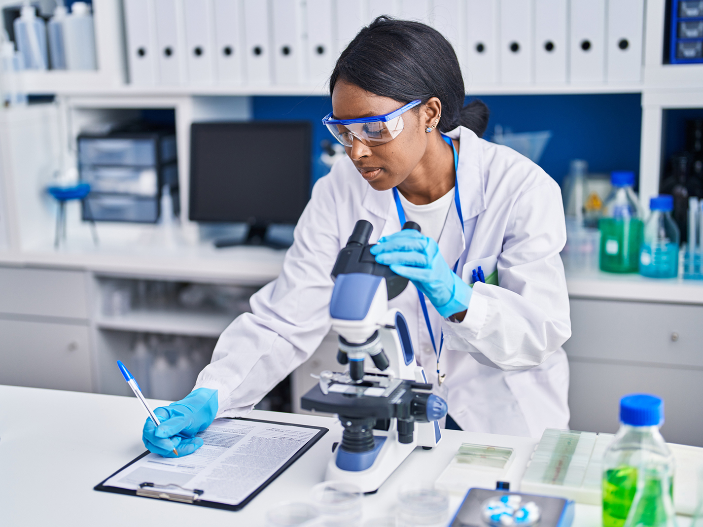 Researcher writing down data