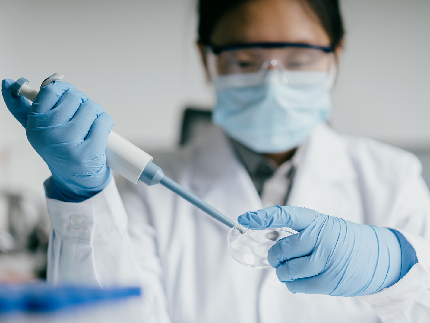 Researcher with pipette