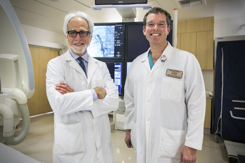 Peter Julien MD and Ashley Wachsman MD in the Interventional Radiology surgical suite