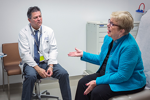 Patient Carol Albright talking to Victor Tapson, MD, director of clinical research at the Lung Institute