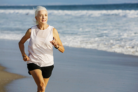 Barbara poledouris running on the beach