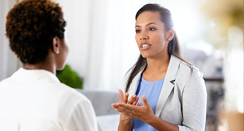 A woman specialist explaining to a patient