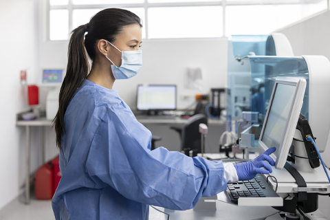 A technician analyzing blood tests