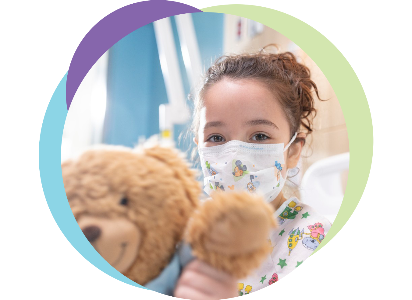 Girl in hospital with teddy bear